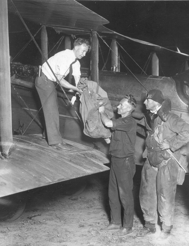 Airmail pilot Paul Collins with first overnight mail bag, July 1, 1925.