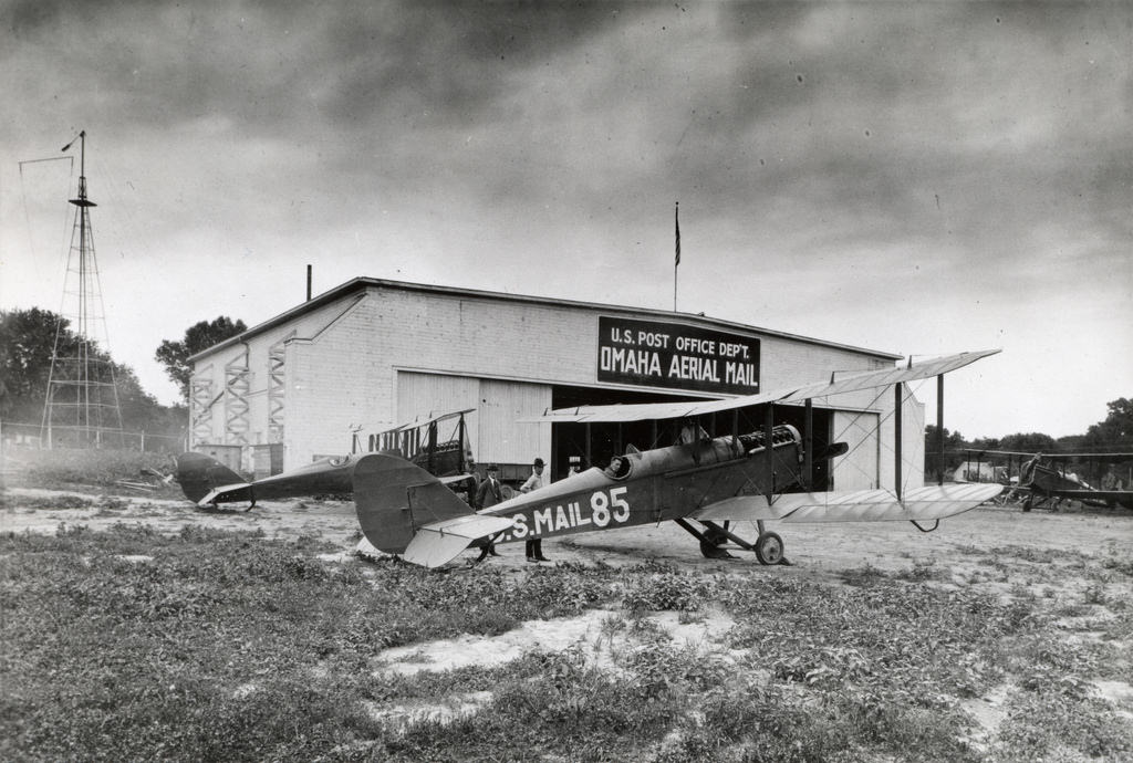 Airmail plane in front of Omaha, Nebraska hangar, 1927.