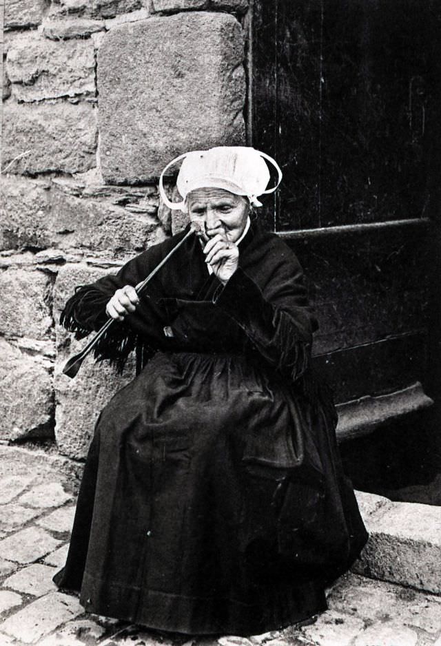 Breton woman smoking a pipe in The Martyrdom.