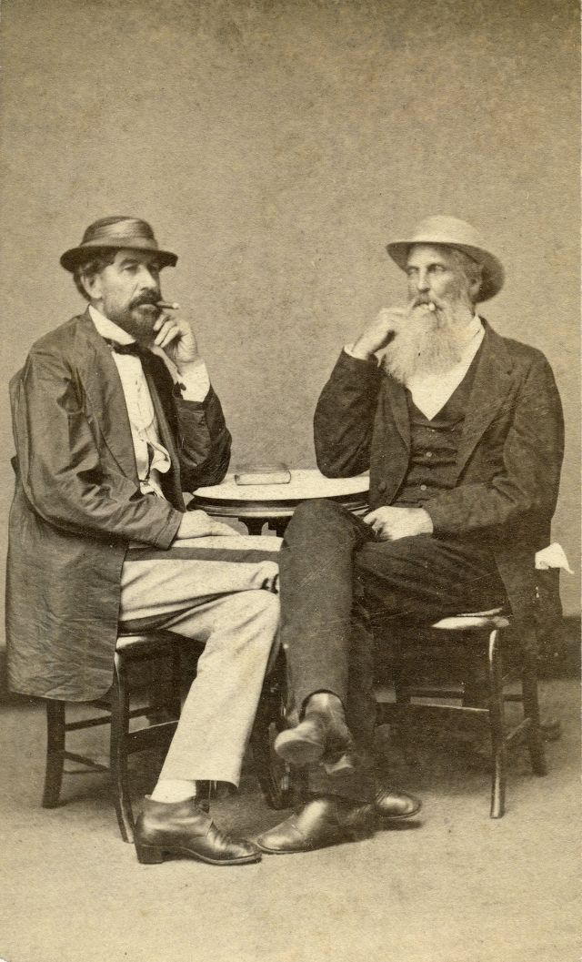 These gents sporting straw hats enjoy cigars inside a photo studio along Canal Street in New Orleans