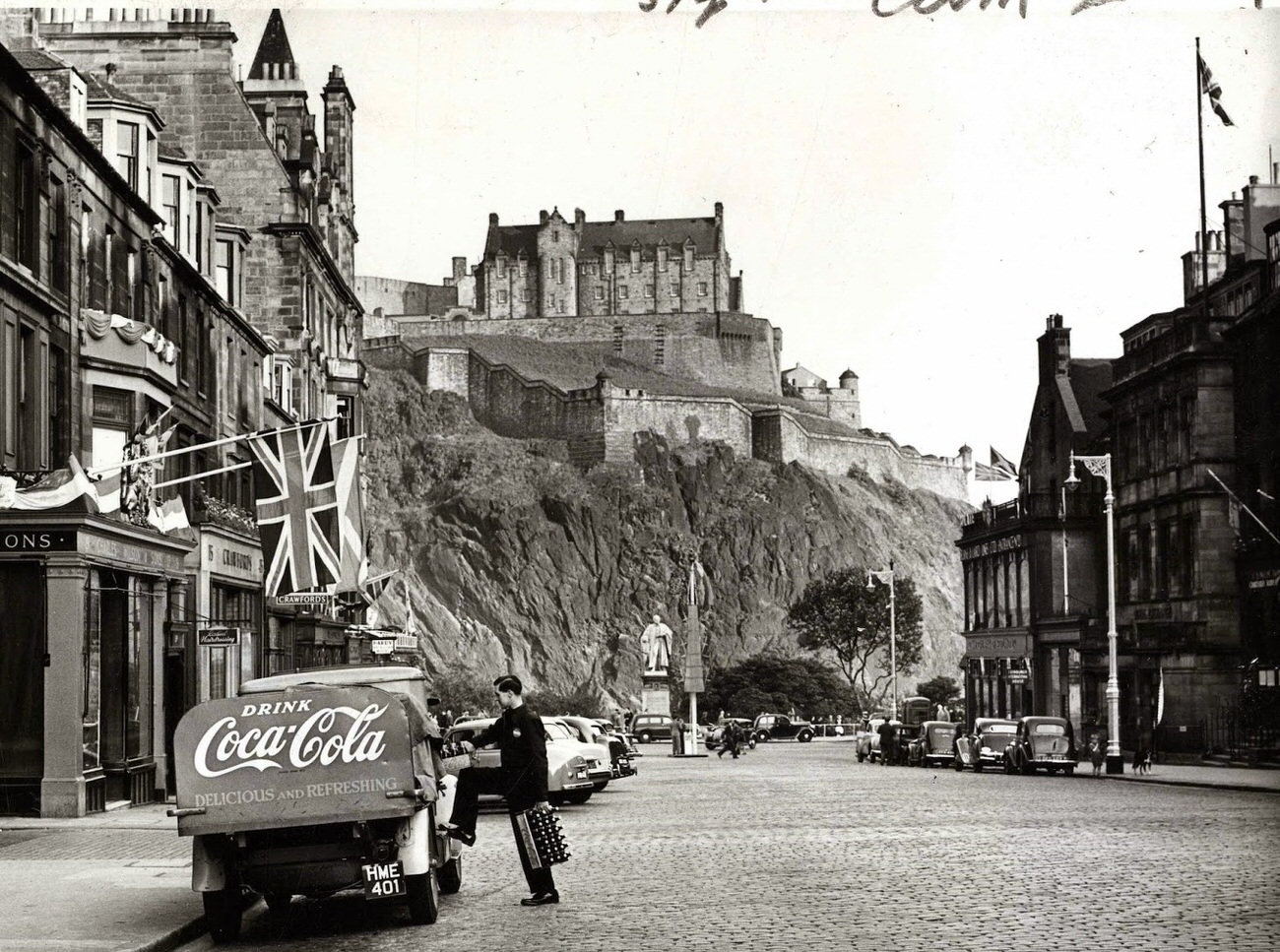 Edinburgh Castle overlooking a Coca-Cola delivery truck on Castle Street, 1953.