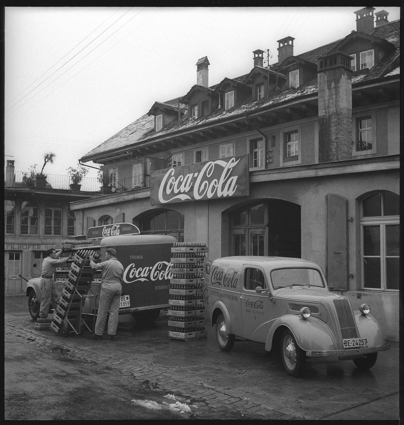 Coca-Cola delivery vans being loaded in Bern, 1949.