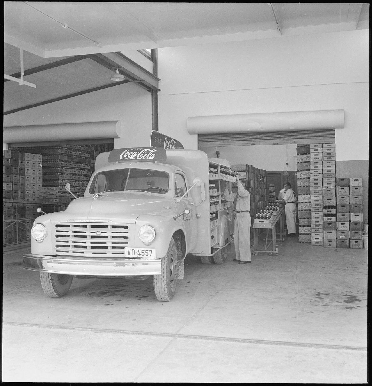 Loading a Coca-Cola delivery van in Lausanne, 1949.