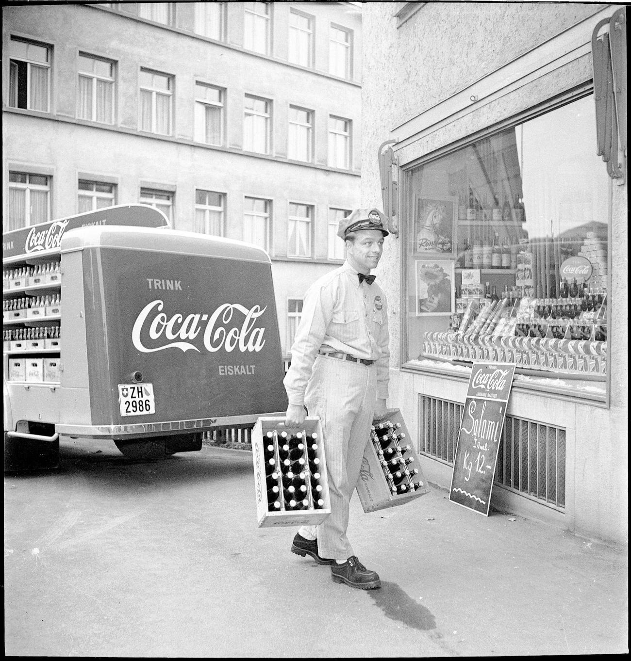 Coca-Cola delivery van making deliveries, 1950.