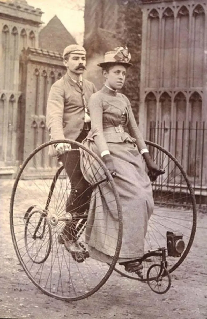 Victorian couple on tandem bicycle, 1890s.