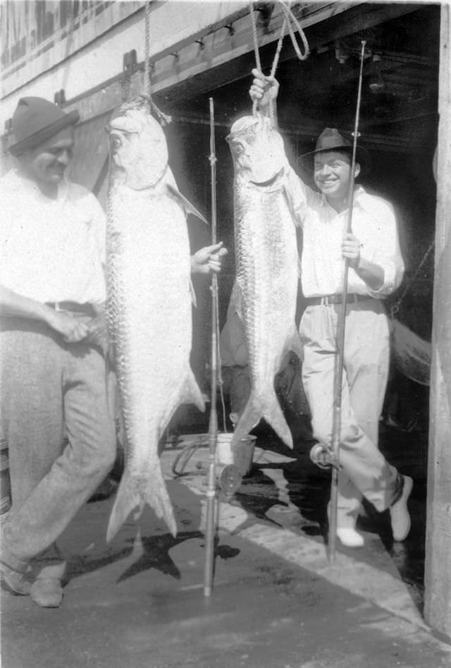 Ernest Hemingway and John Dos Passos with tarpons, Key West, Florida, 1928.