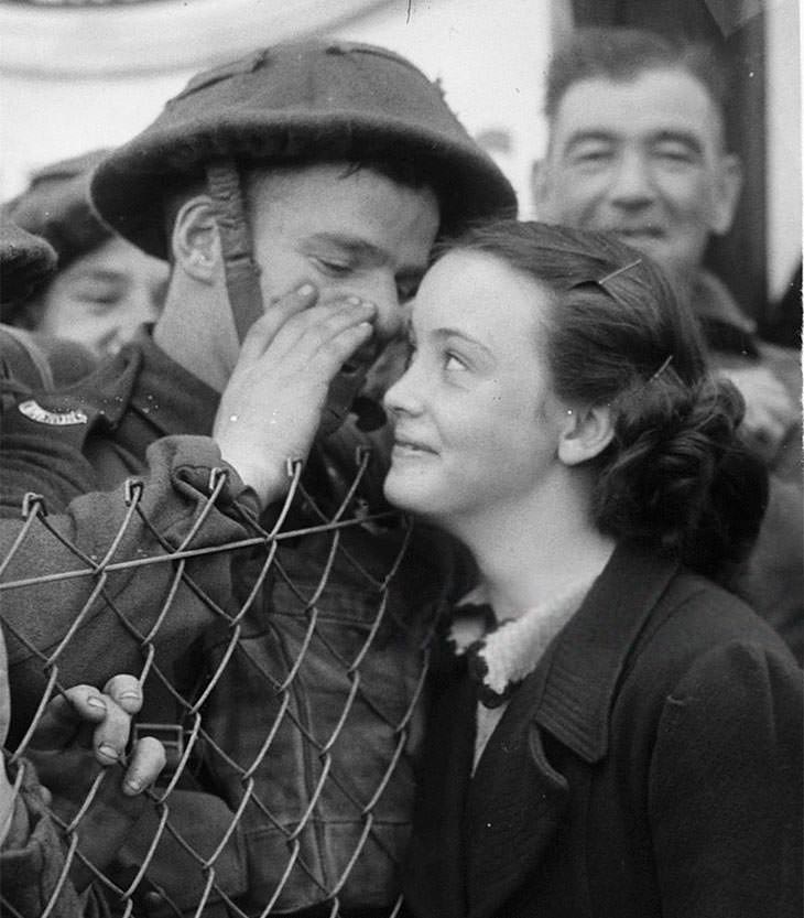 British soldier whispering to loved one, 1939.