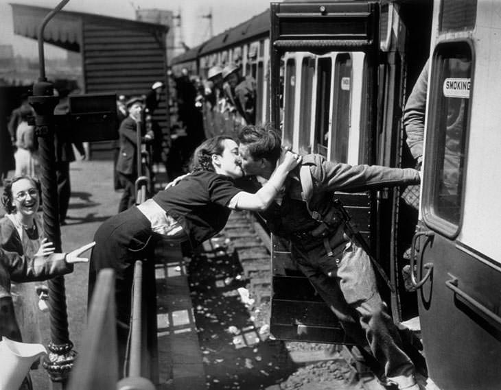 Woman kissing returning British soldier, London, 1940.