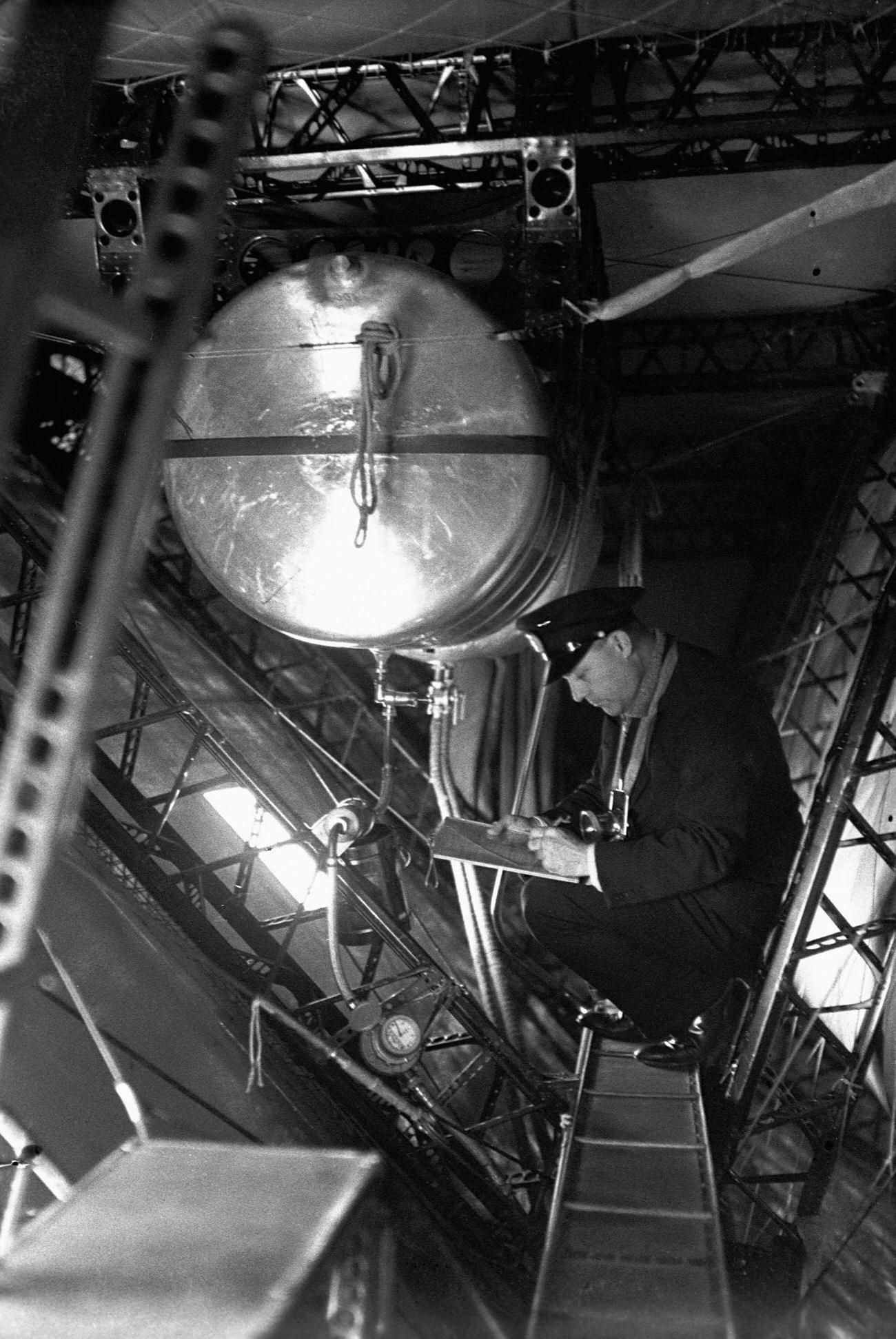 Man Taking Notes Inside the Hindenburg Airship