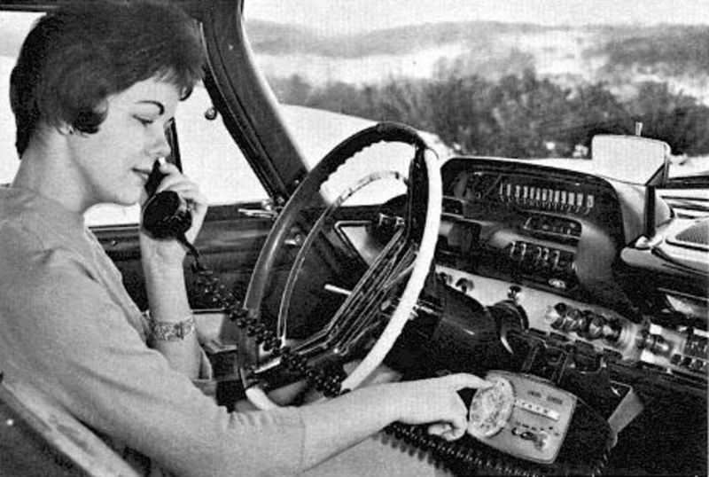 DeSoto car with early phone, 1950s.