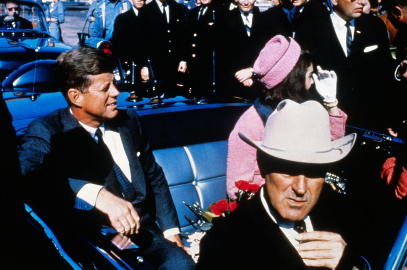 John F. Kennedy, First Lady Jacqueline Kennedy, and Texas Governor John Connally in a motorcade from Dallas airport, 1963.