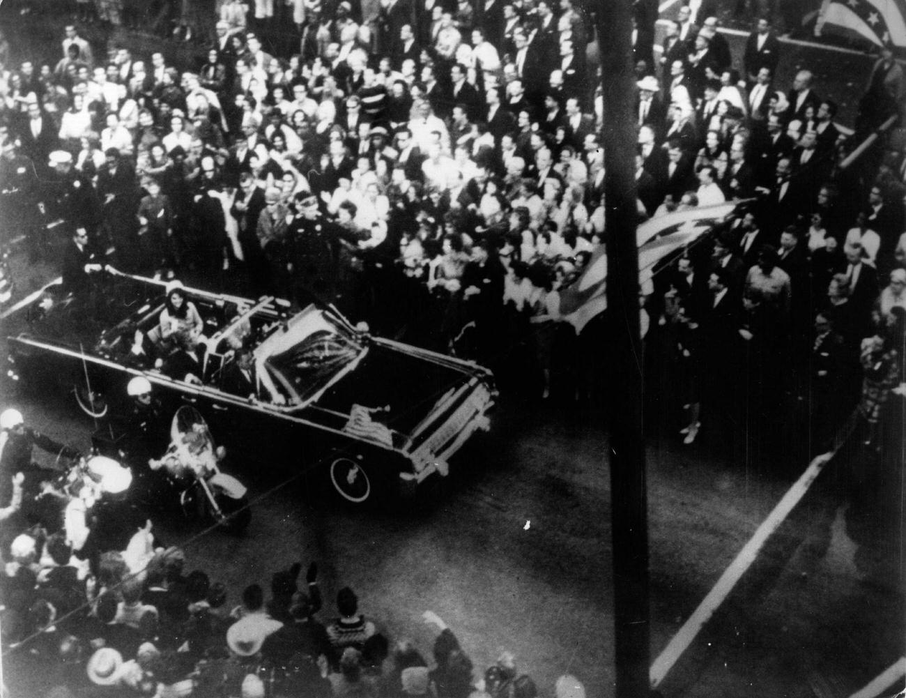 John F. Kennedy and First Lady Jacqueline Kennedy in the presidential motorcade in Dallas, Texas, shortly before his assassination, 1963.