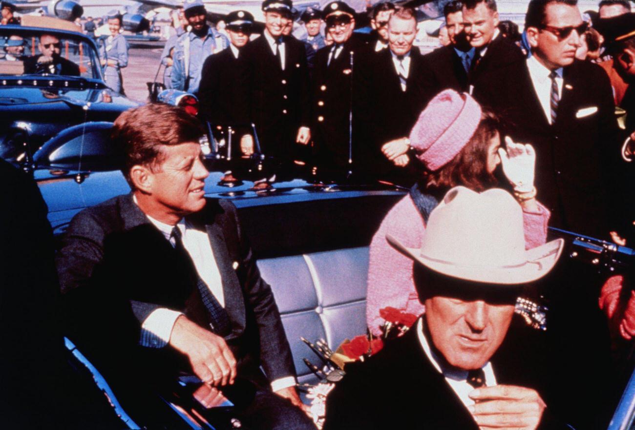 Texas Governor John Connally, US President John F. Kennedy, and First Lady Jacqueline Kennedy prepare for a Dallas motorcade from the airport, 1963.