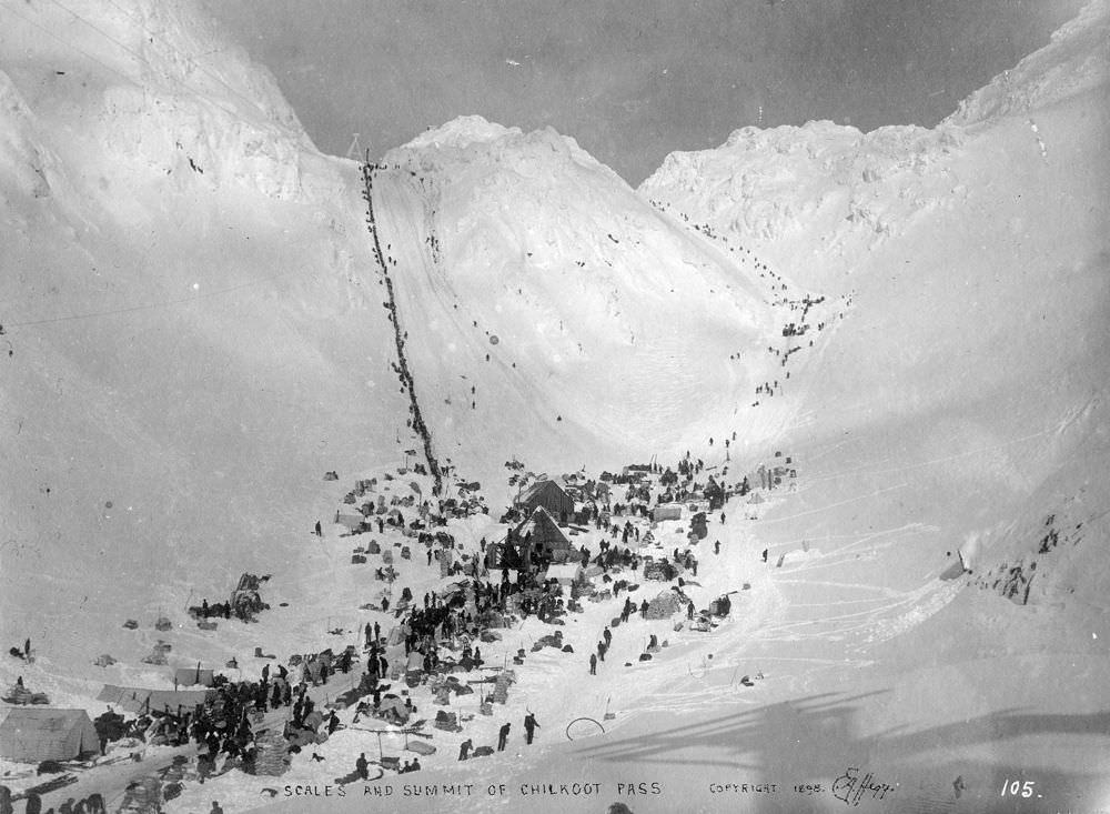 Prospectors with supplies at Chilkoot Pass, featuring The Scales and Golden Steps, circa March 1898.