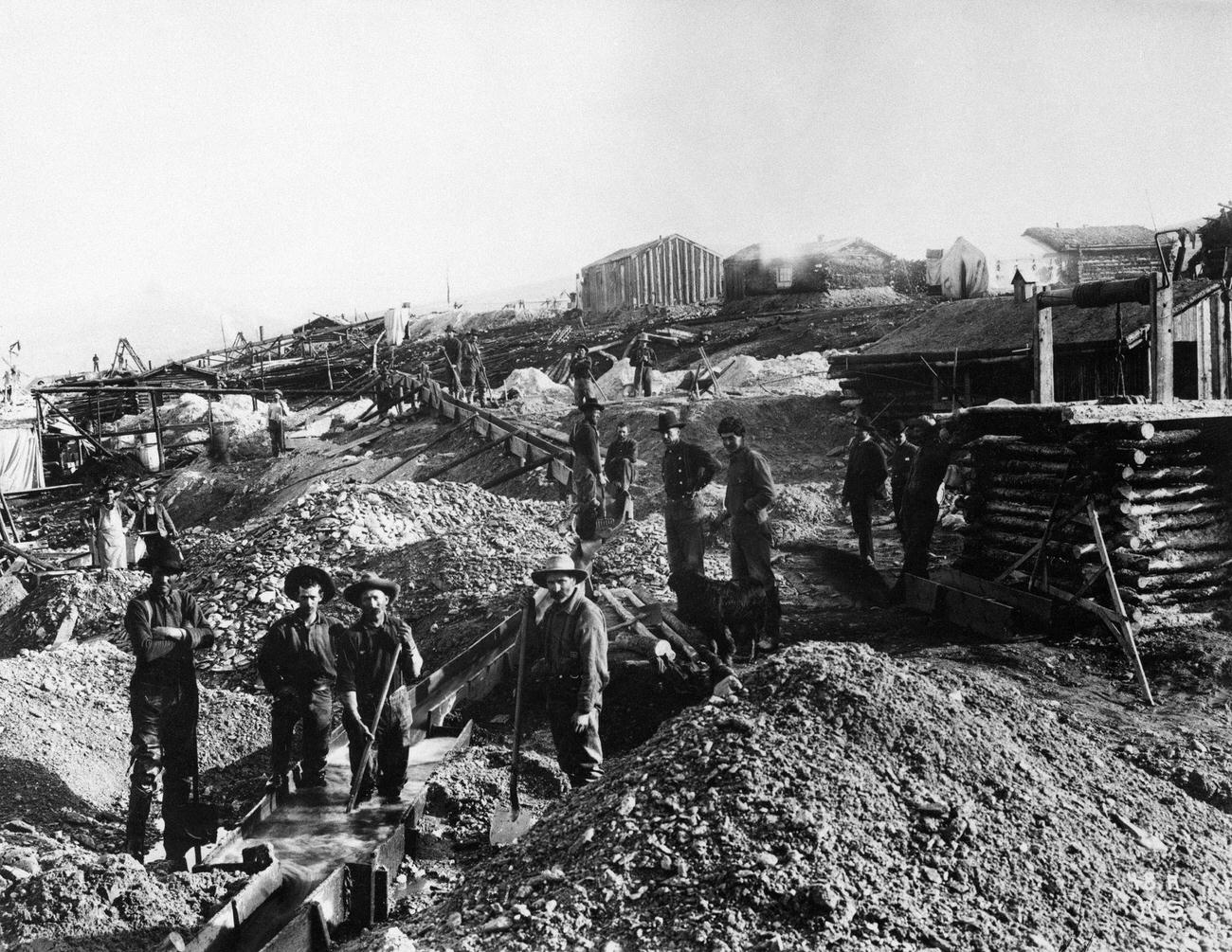 Miners using sluices to mine gold on "Gold Hill" near Dawson in the Yukon Territories, Canada.