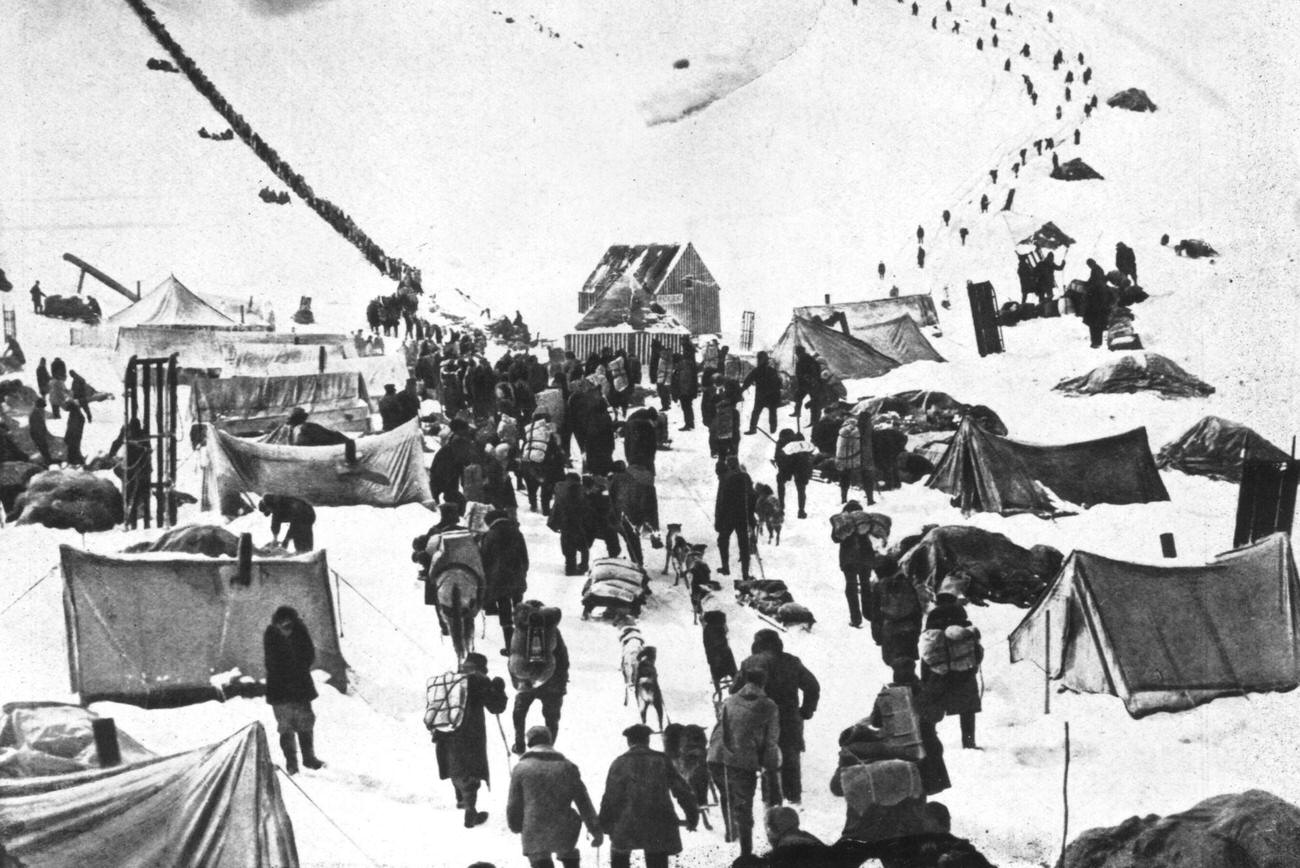 A caravan of prospectors arriving in the snowy Klondike, Canada, to join the Gold Rush, 1895.