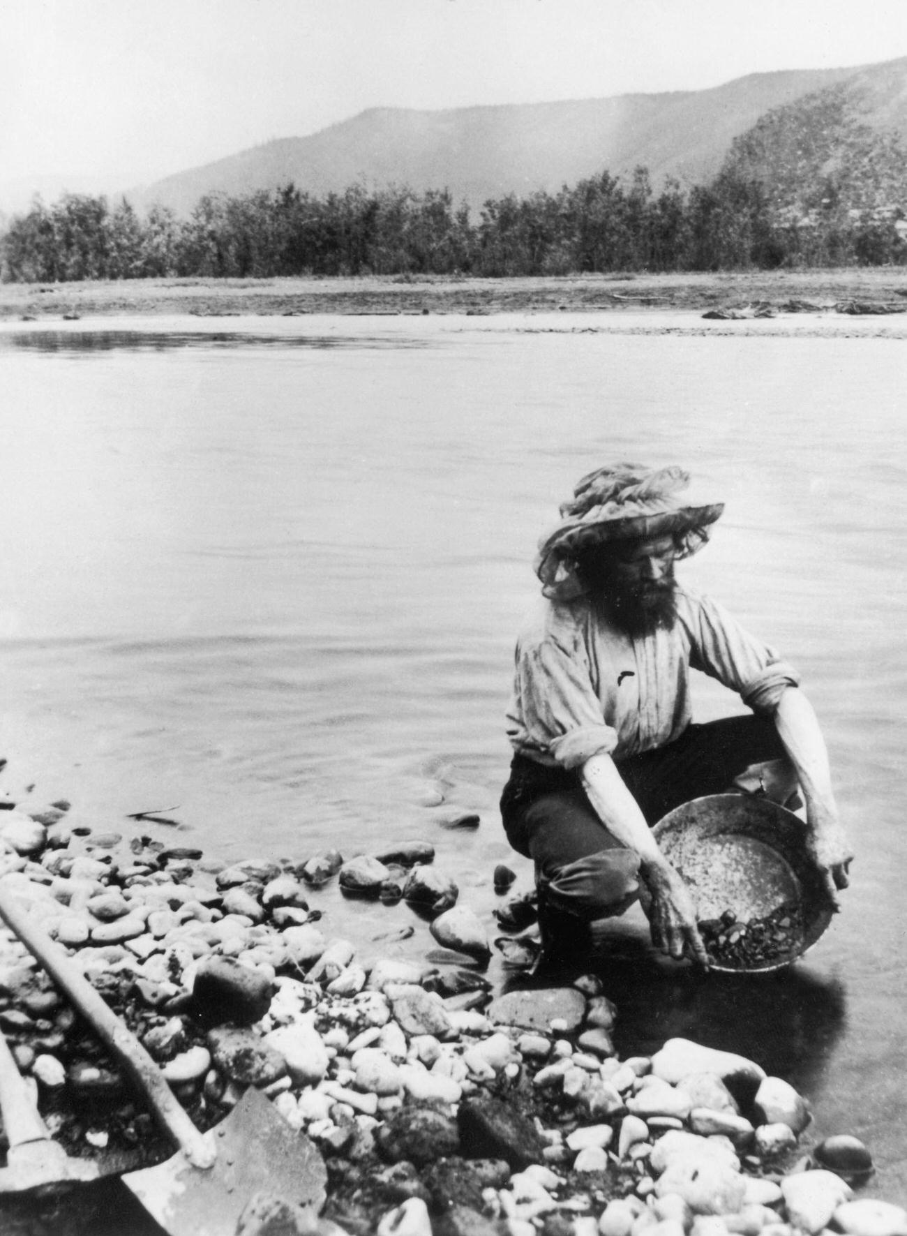 A gold prospector panning for alluvial gold in the Klondike, Yukon Territory, Canada, 1898.