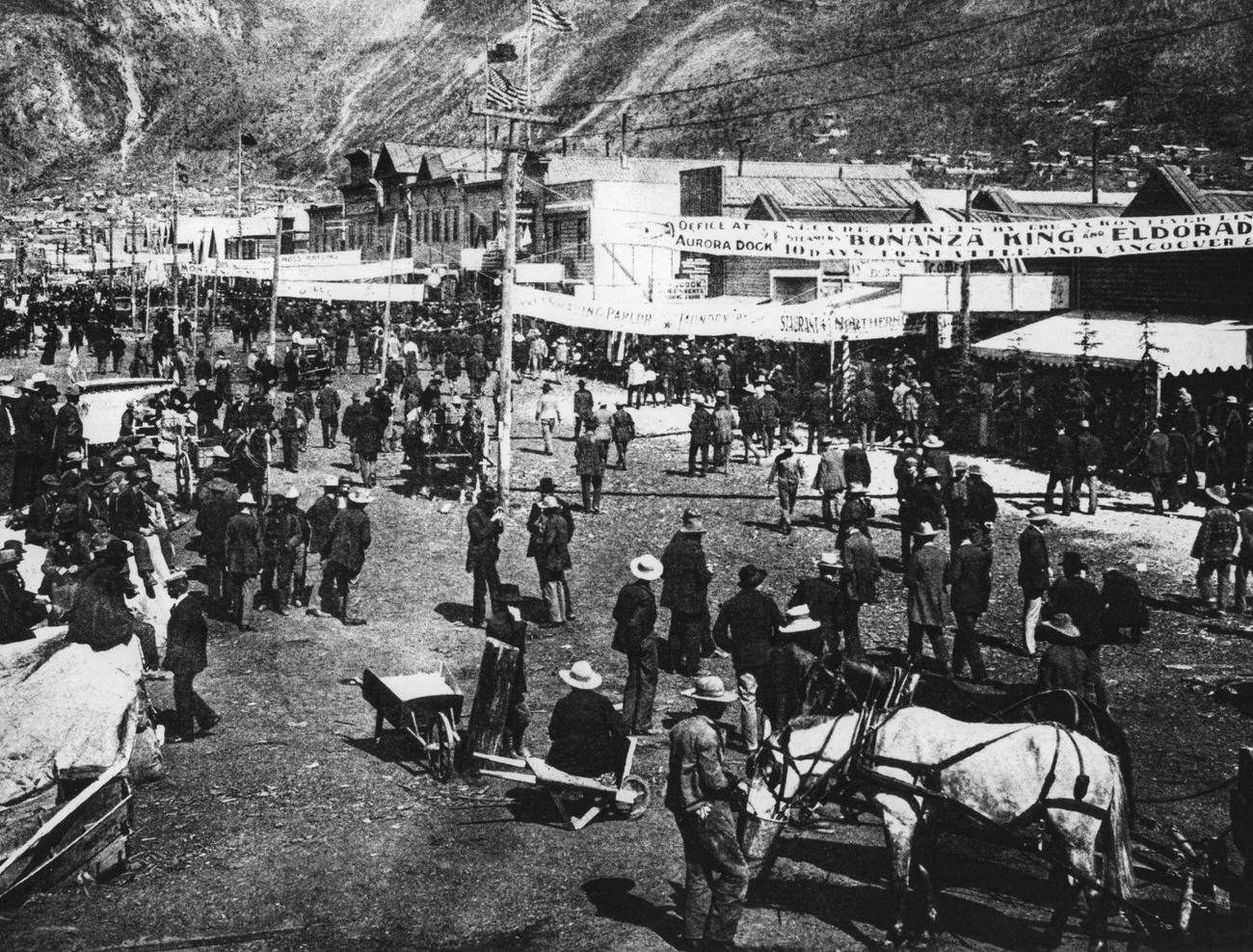 Gold prospectors on the main street of Dawson City during the Klondike Gold Rush, Canada, 1899.