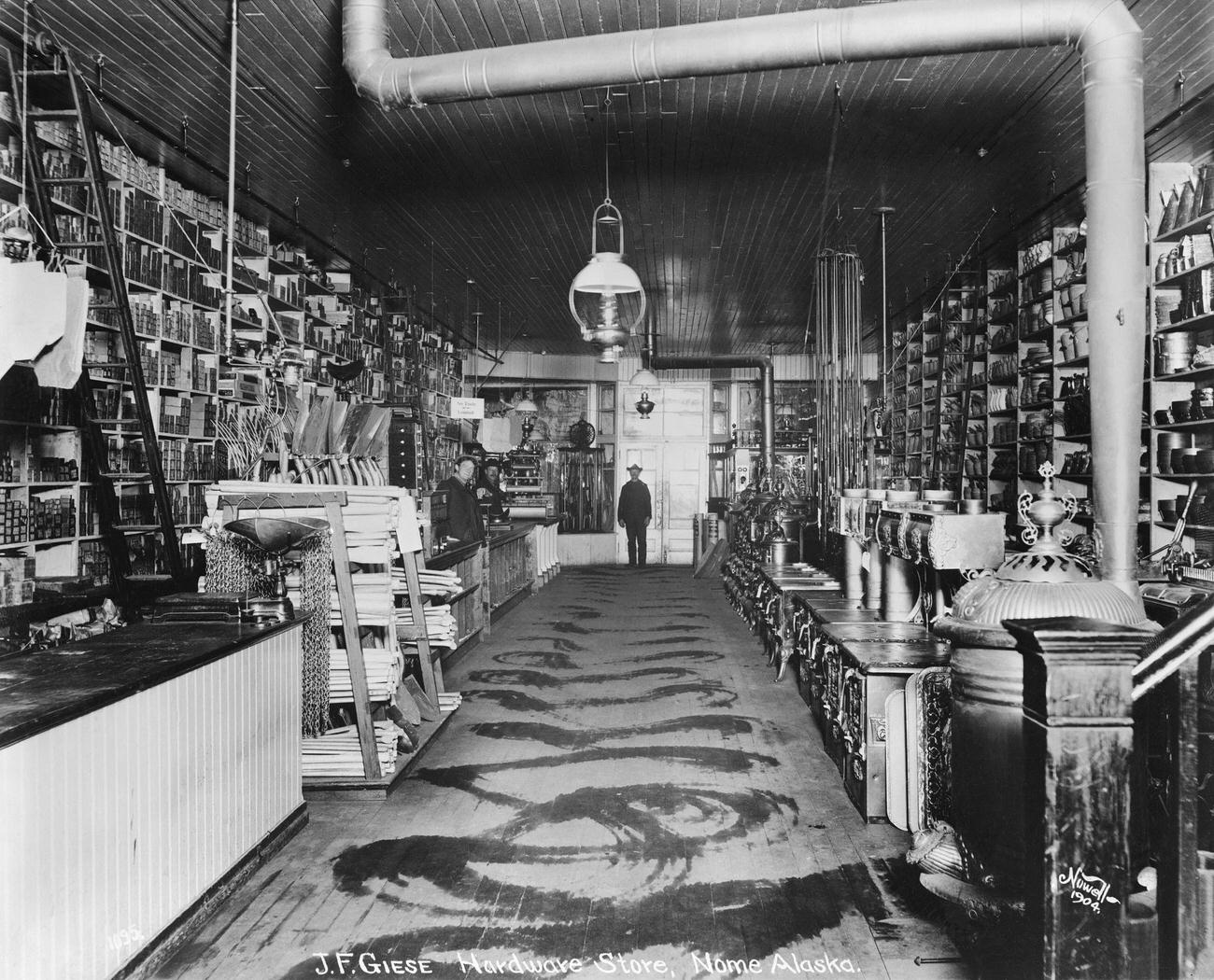 J.F. Giese's hardware store in Nome, Alaska, during the Klondike Gold Rush, 1904.