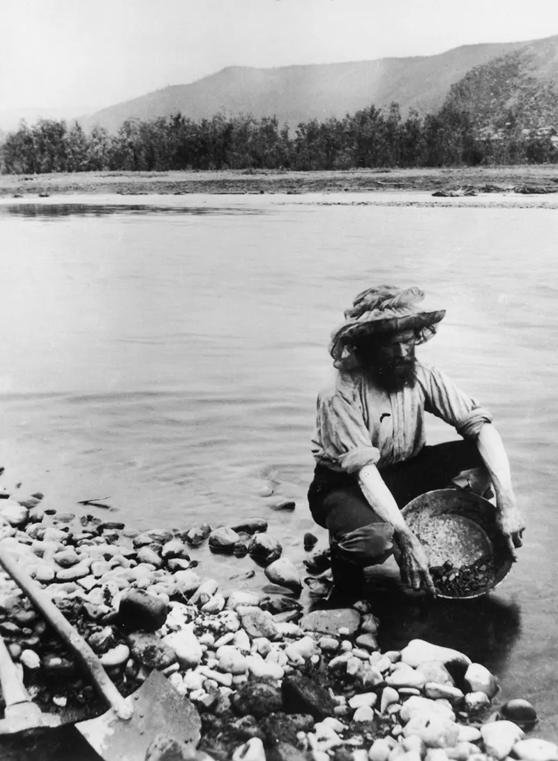 A prospector panning for gold in the Yukon Territory, 1898.