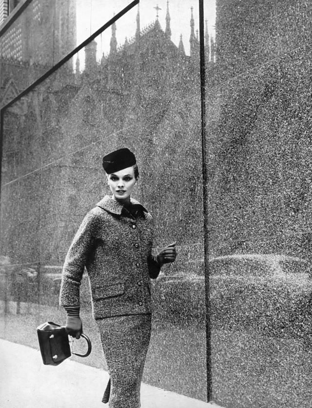 Linda Harper in a black and sepia tweed suit with a white collar by Ben Zuckerman, 1954.