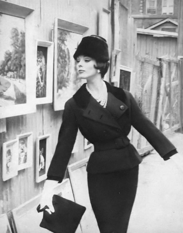 Linda Harper in a black wool suit with Jet velvet details by Dan Millstein, 1959.