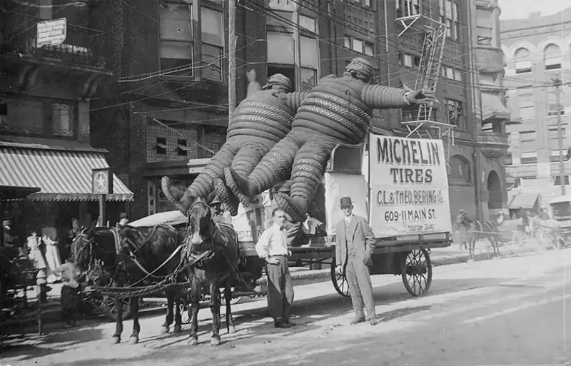 Horse-drawn advertising carriage with Michelin men, 1911.