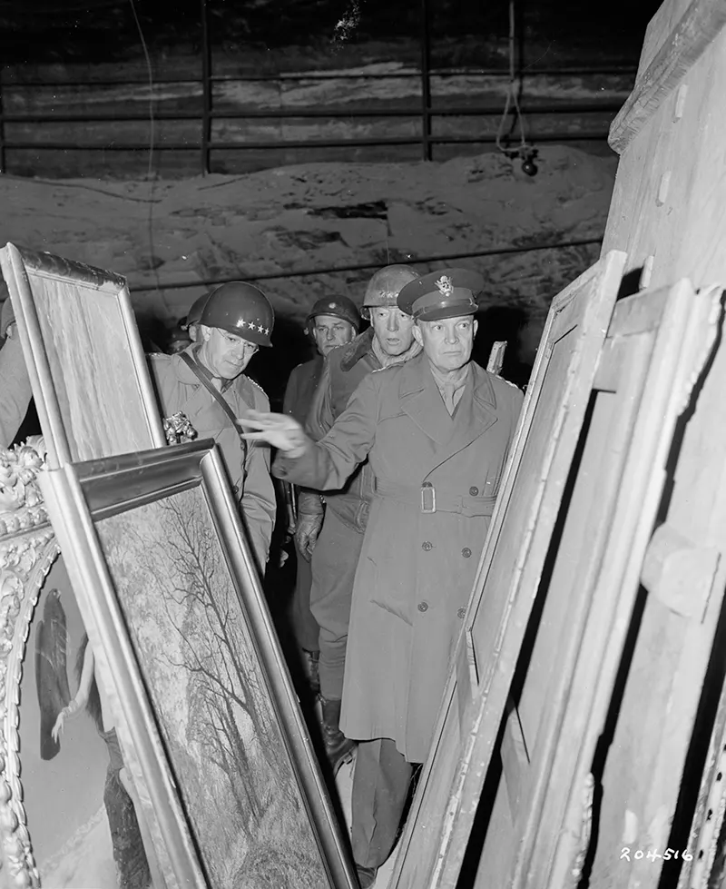 Gen. Dwight D. Eisenhower, Gen. Omar N. Bradley, Lt. George S. Patton inspecting looted art, German salt mine.