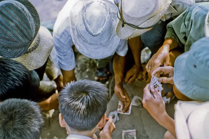 Local men playing cards, northeast My Tho, 1969.