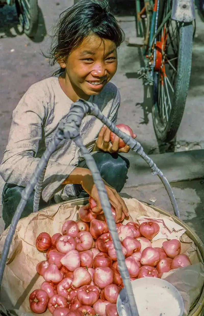 Girl selling produce, My Tho market, 1969.