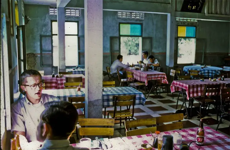 Captain Kozak, Lieutenant Short at Chinese lunch, Dinh Tuong Province, 1969.