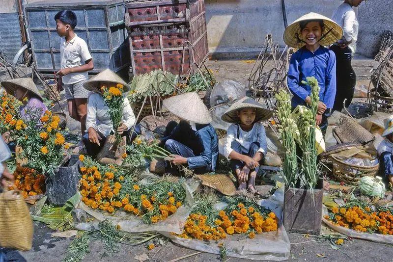 Marigold vendors for TET celebration, My Tho market, 1969.