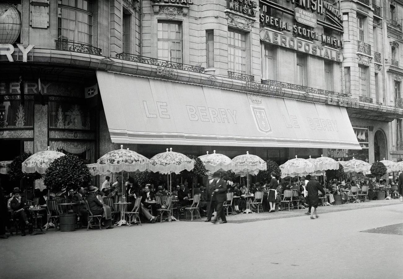 Outdoor Seating at a Cafe with Umbrella Sunshades