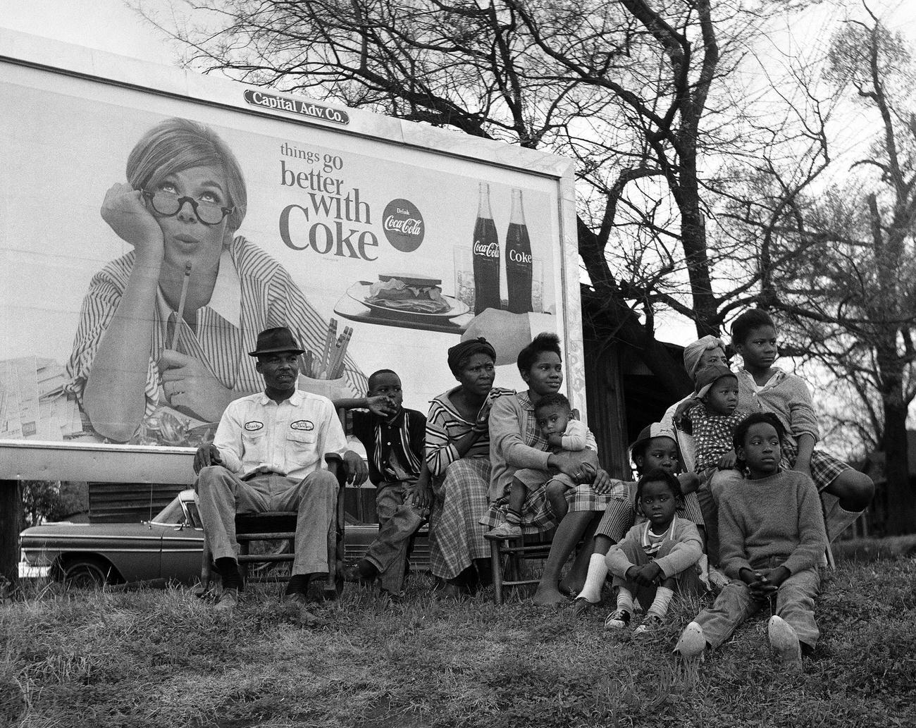 African American family watching the Selma To Montgomery Civil Rights March, March 25, 1965.