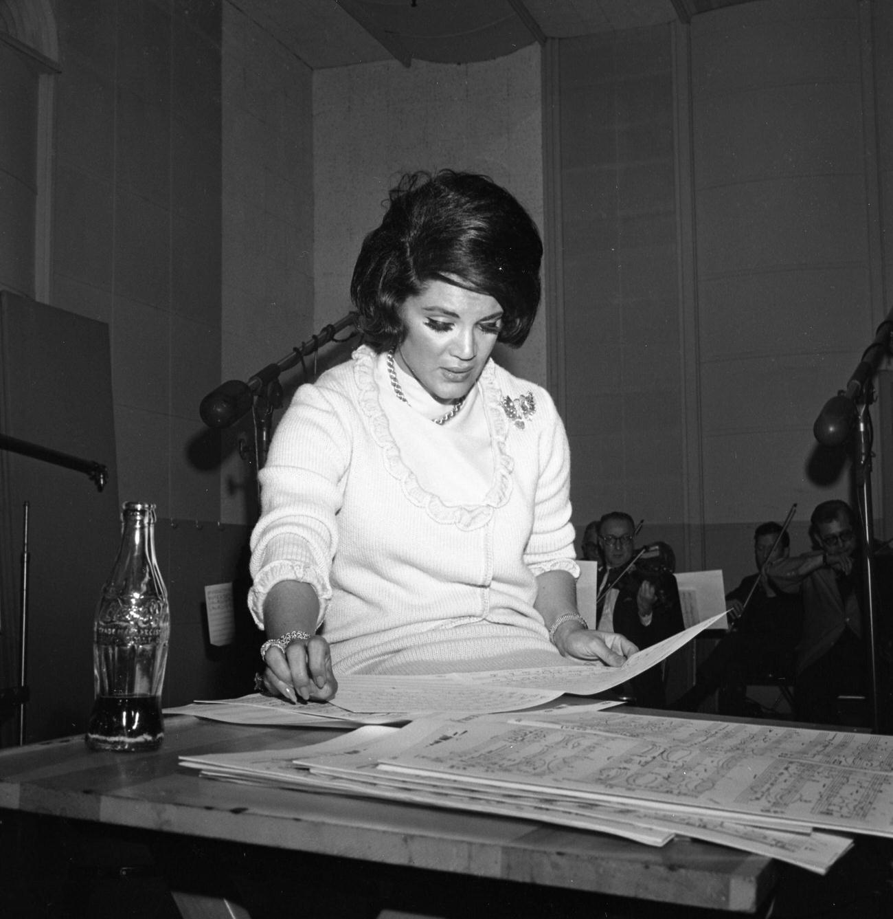 Connie Francis recording with a bottle of Coca-Cola, New York, 1966.