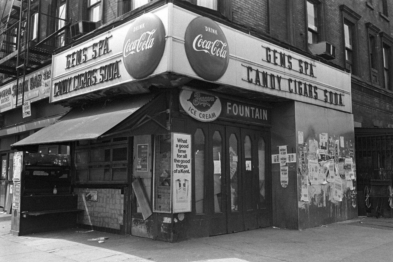 Gems Spa, a candy store in East Village, New York, advertising Coca-Cola.