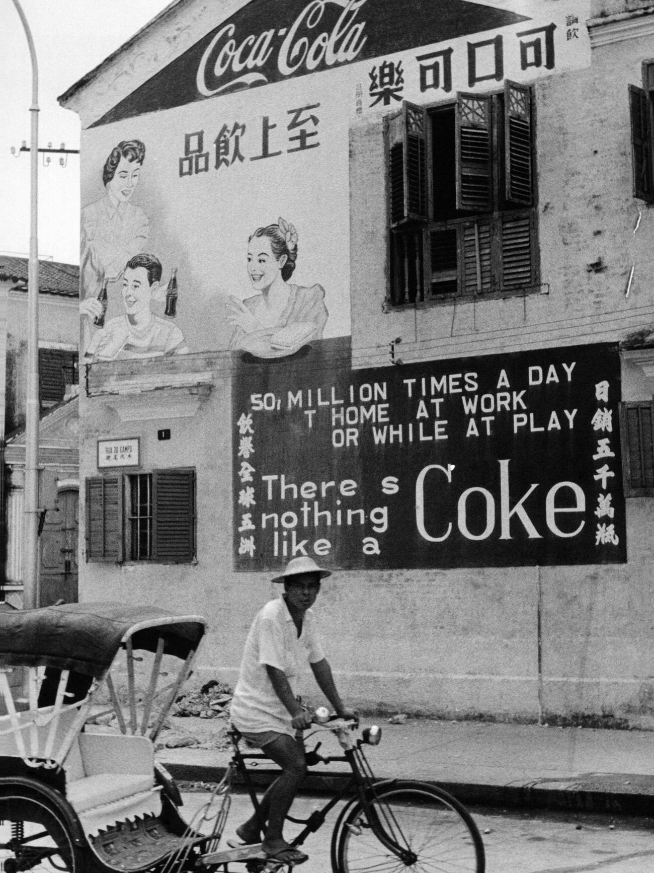 Coca-Cola advertisement on a house facade in Macao.