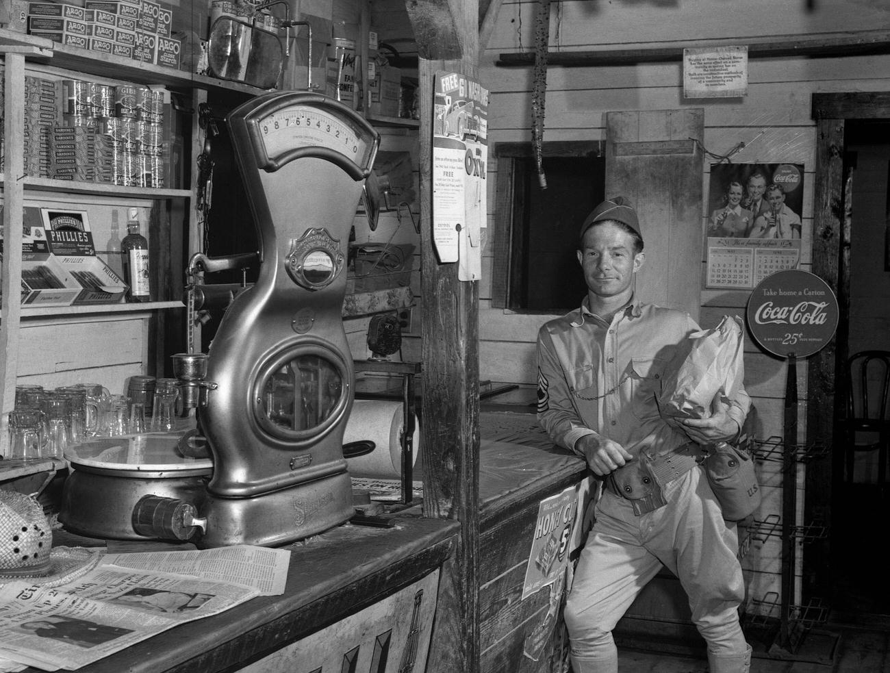 A soldier shopping in a general store in Caroline County, Virginia, June 1941.