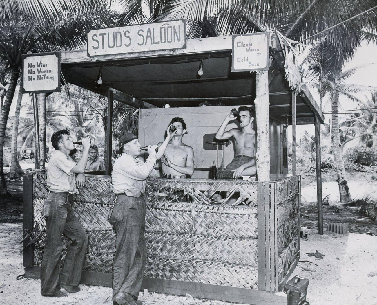 Seamen and customers enjoying Coca-Colas at a soft drink stand in the Marshall Islands, July 10, 1946.