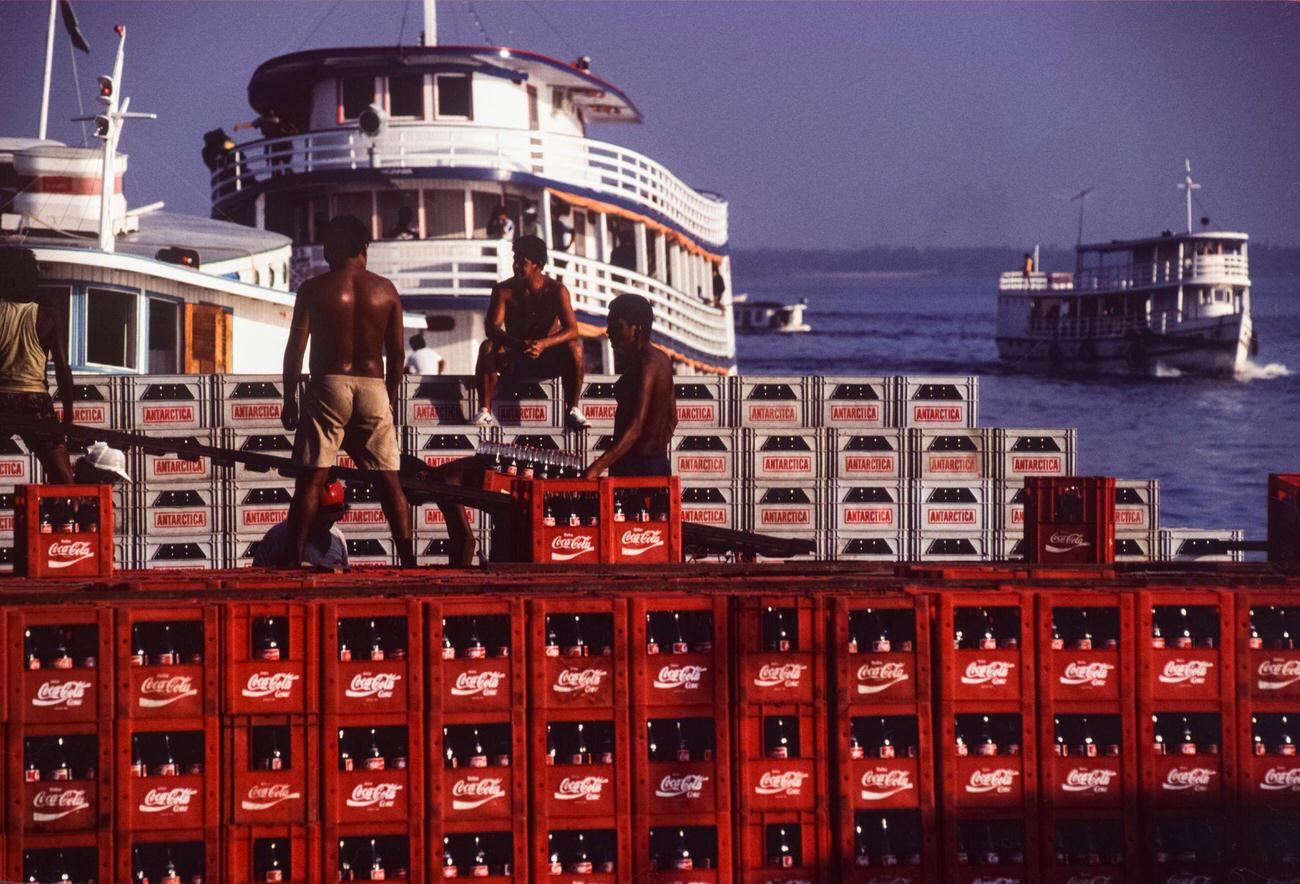 Unloading a Coca-Cola cargo at the port of Manaus, Brazil.