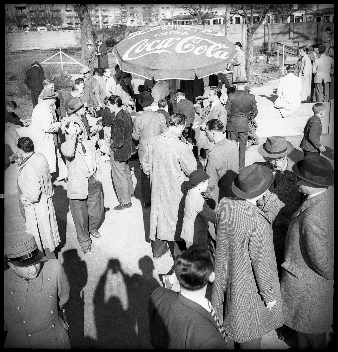 Selling Coca-Cola during a football match, 1949.