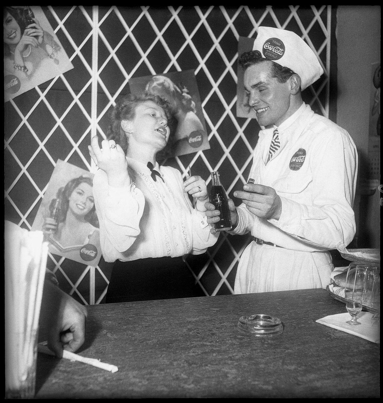 Coca-Cola employees taking a break, 1949.