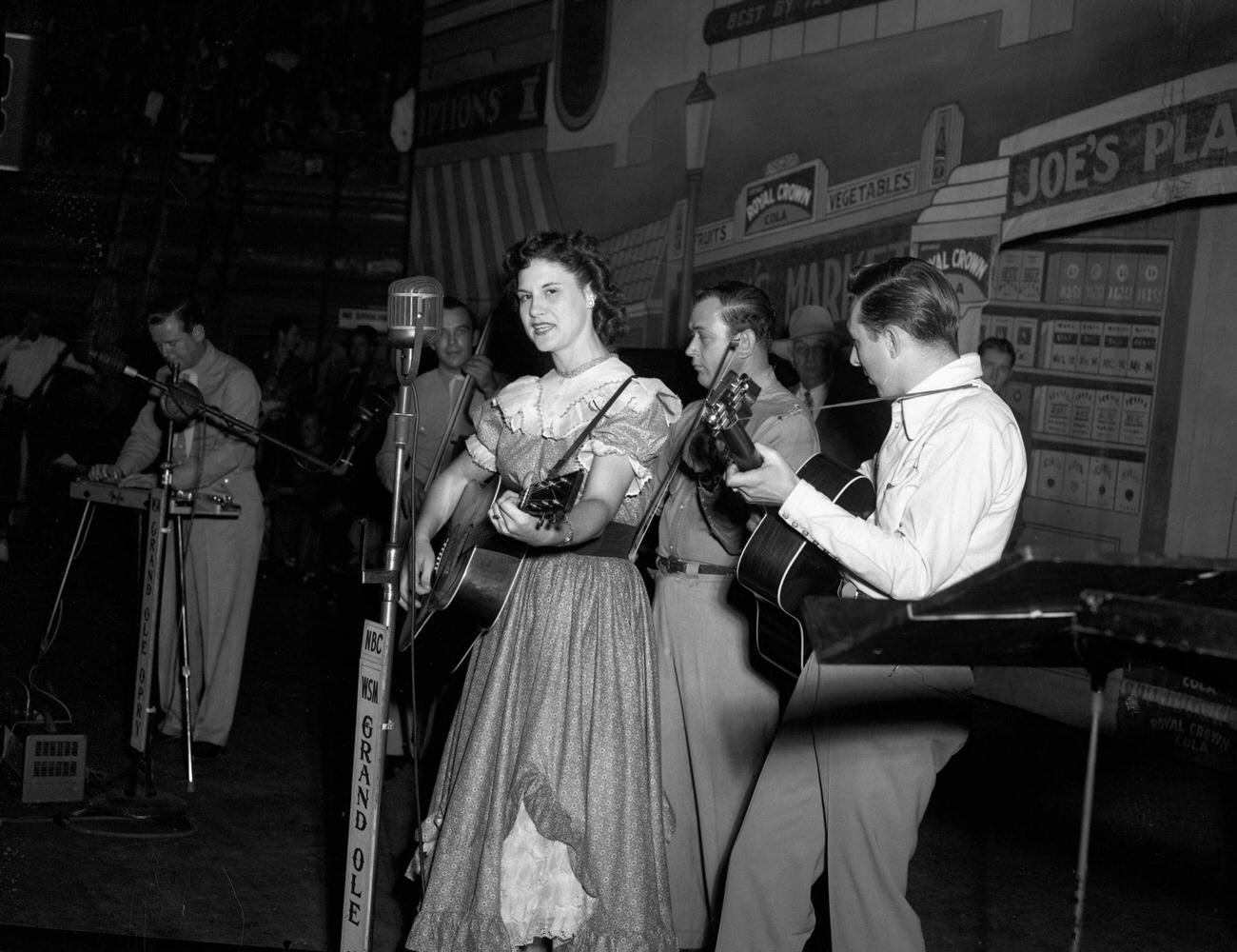 Country singer Kitty Wells performing at the Grand Ole Opry, circa 1950, Nashville, Tennessee.