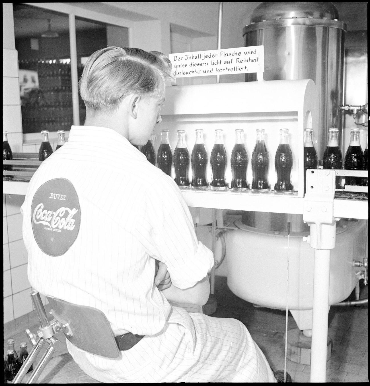 Coca-Cola worker at a bottling plant in Zurich, 1950.