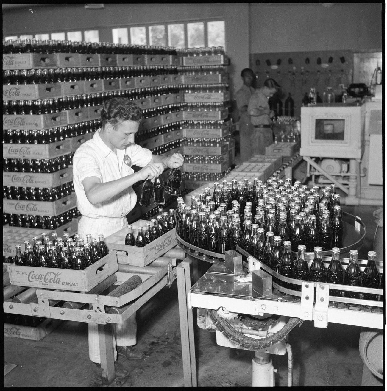 Coca-Cola worker at a bottling plant in Zurich, 1950.