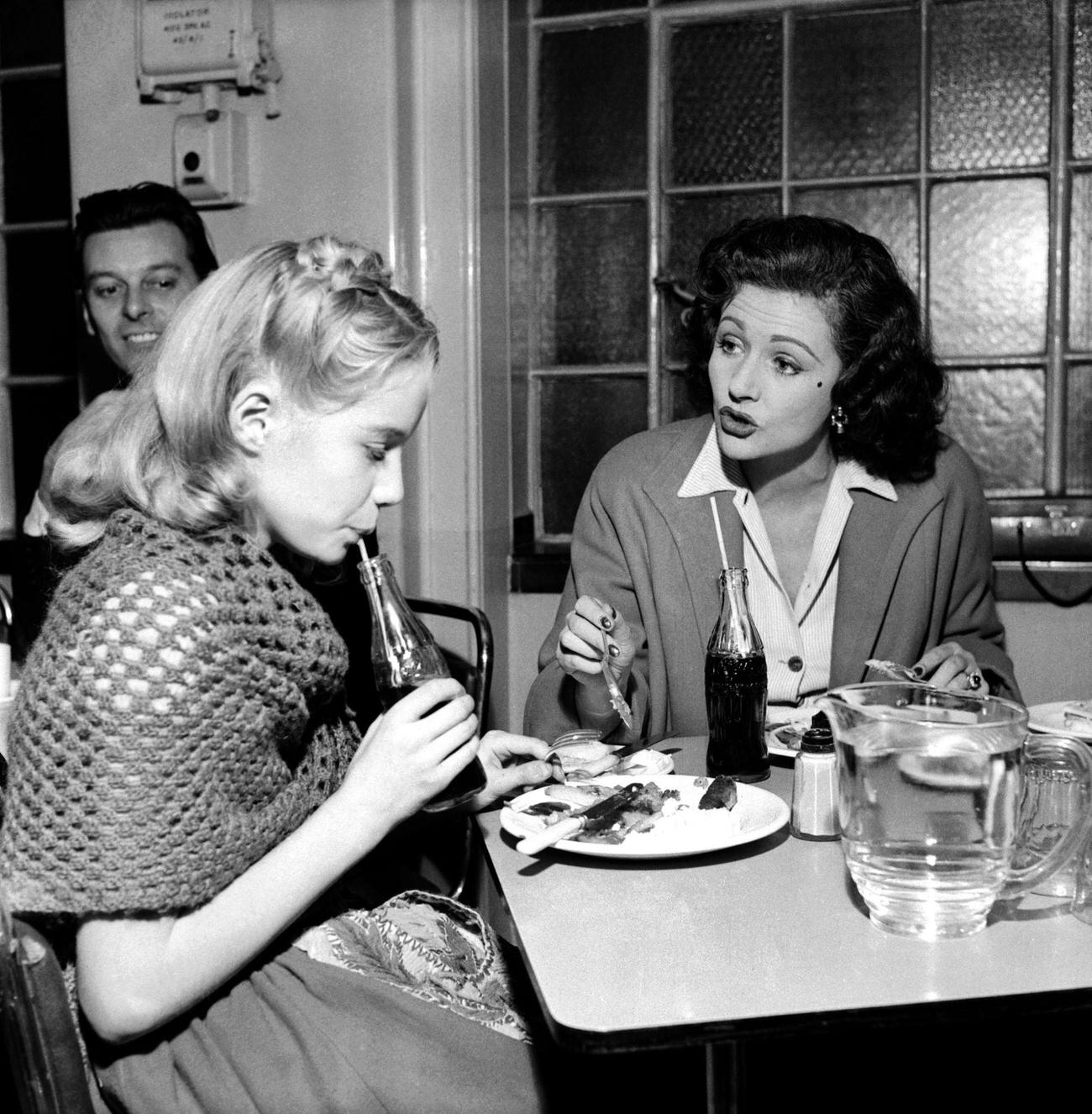 Margaret Lockwood chaperoning her daughter Julia in a TV program, November 1953.