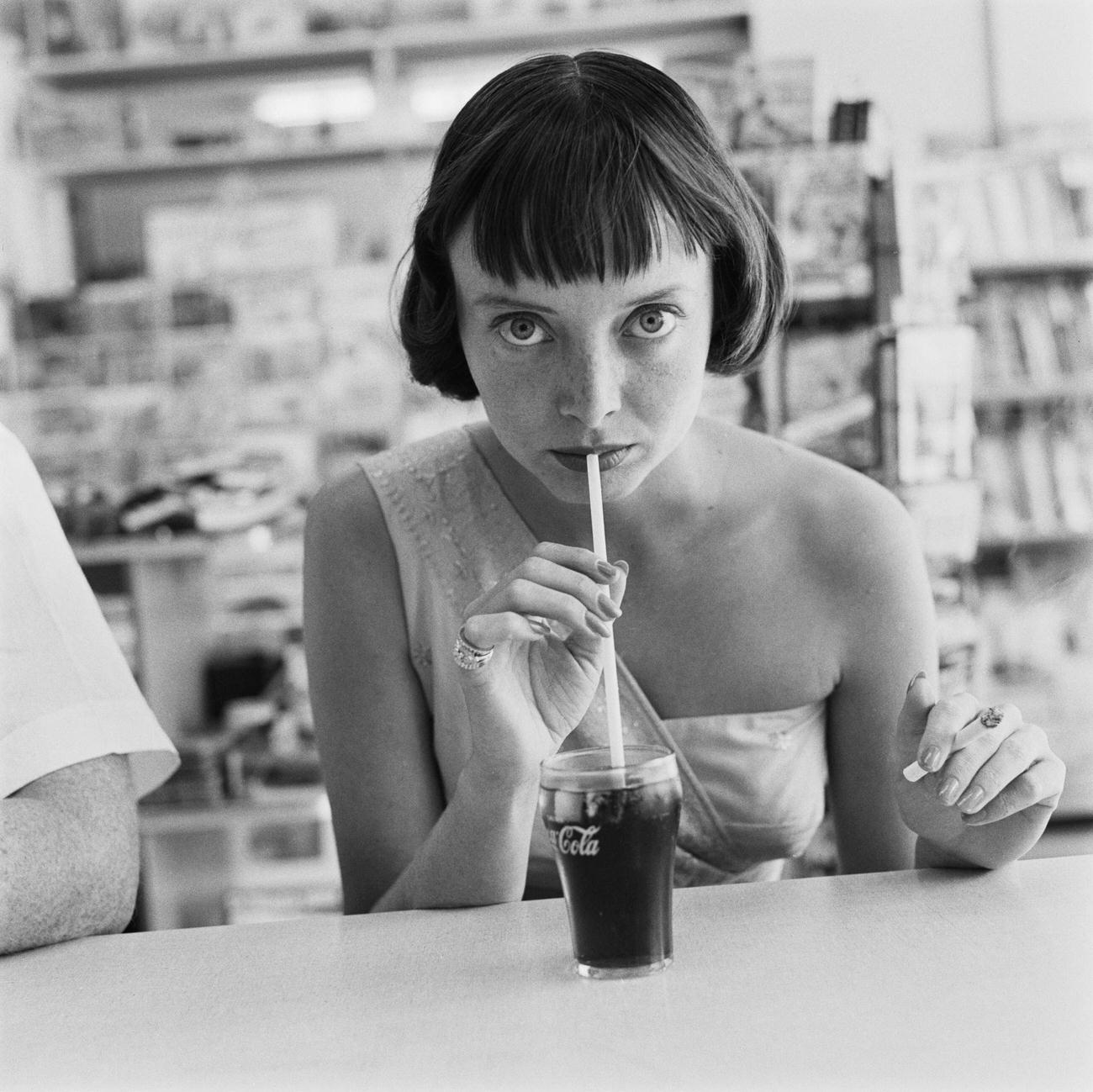 Actress Carolyn Jones drinking Coca-Cola, USA, circa 1956.