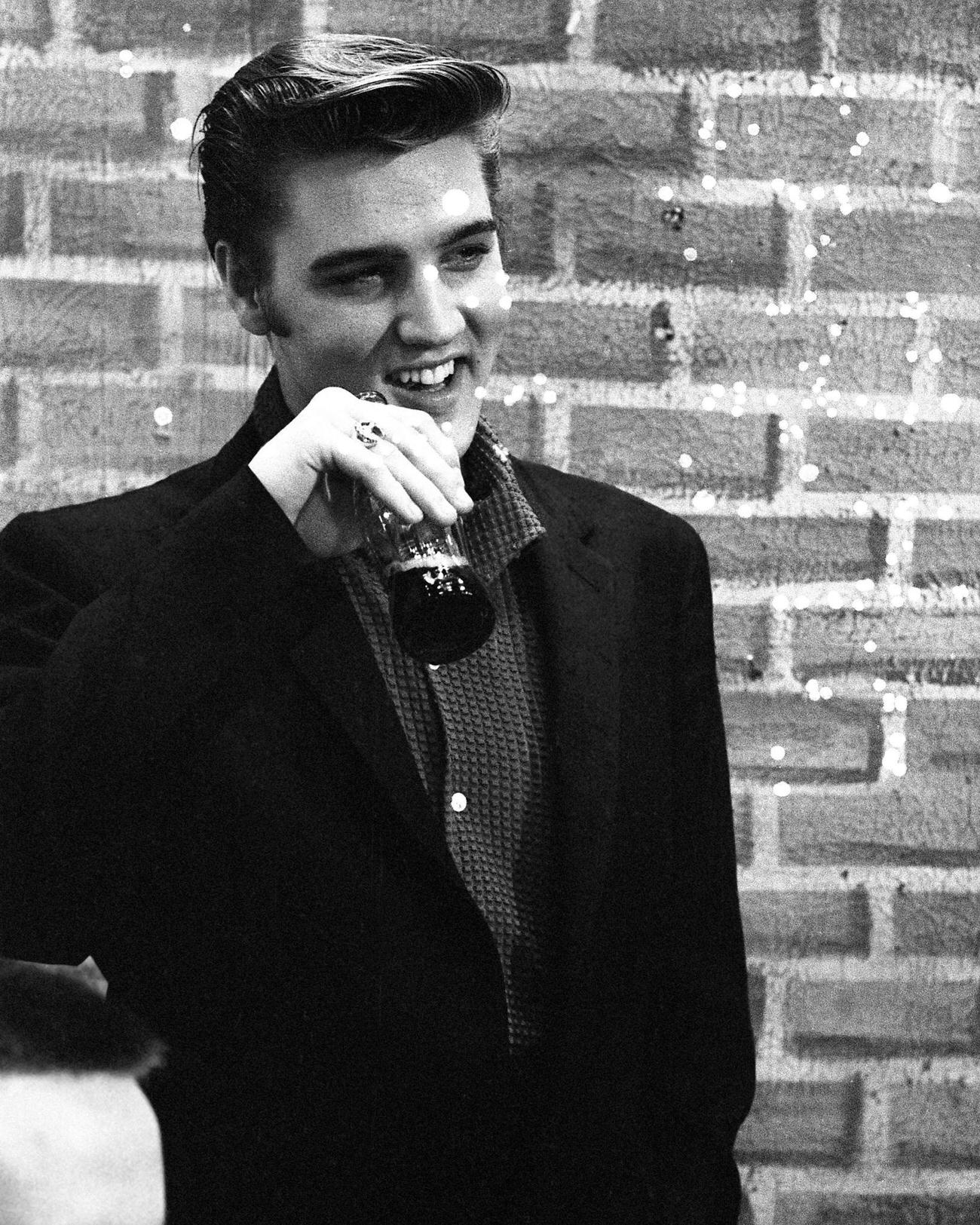 Singer Elvis Presley drinking Coca-Cola backstage on Wink Martindale's show in Memphis, June 16, 1956.