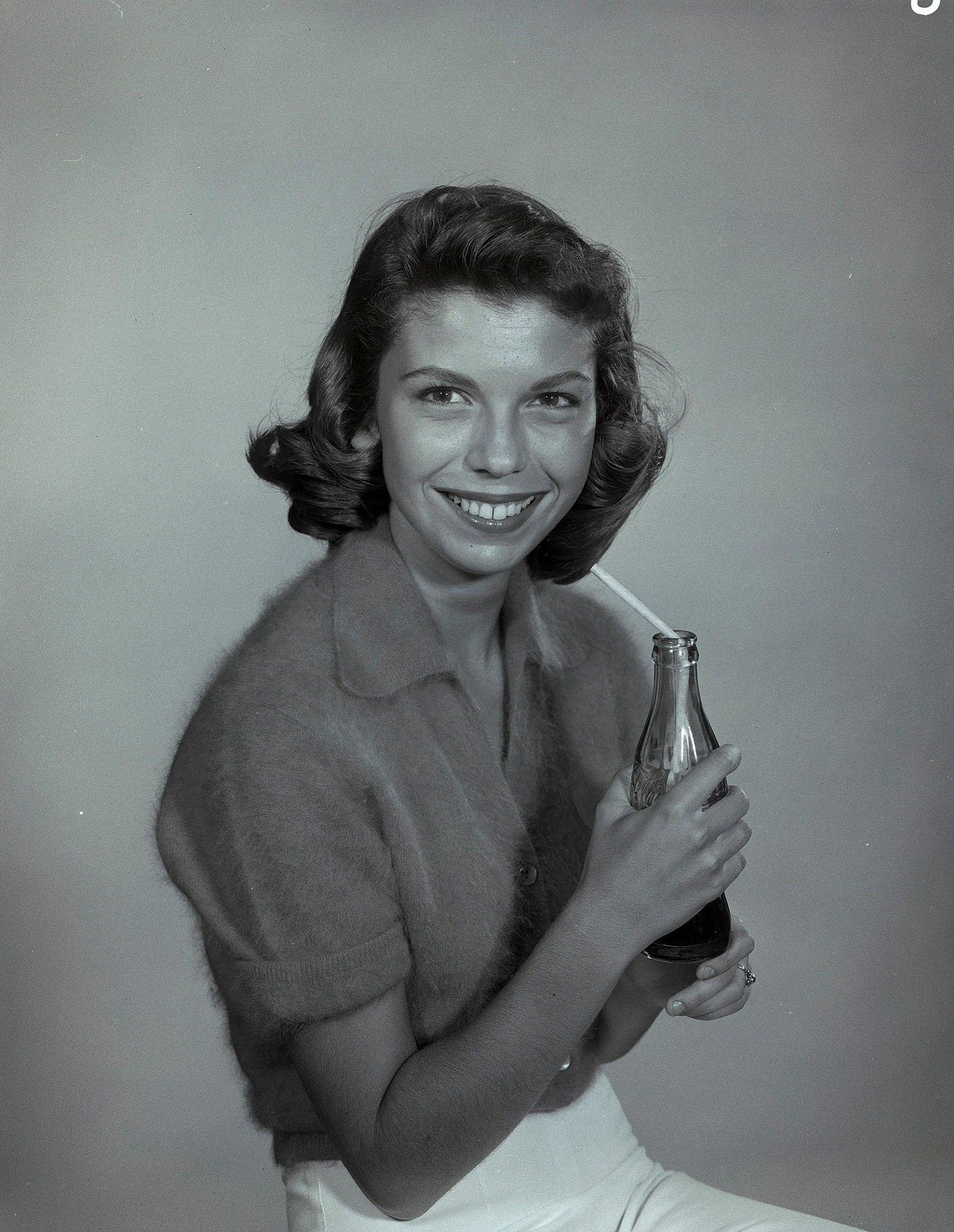 Nancy Sinatra holding a Coca-Cola bottle on "The Frank Sinatra Show,", 1957.