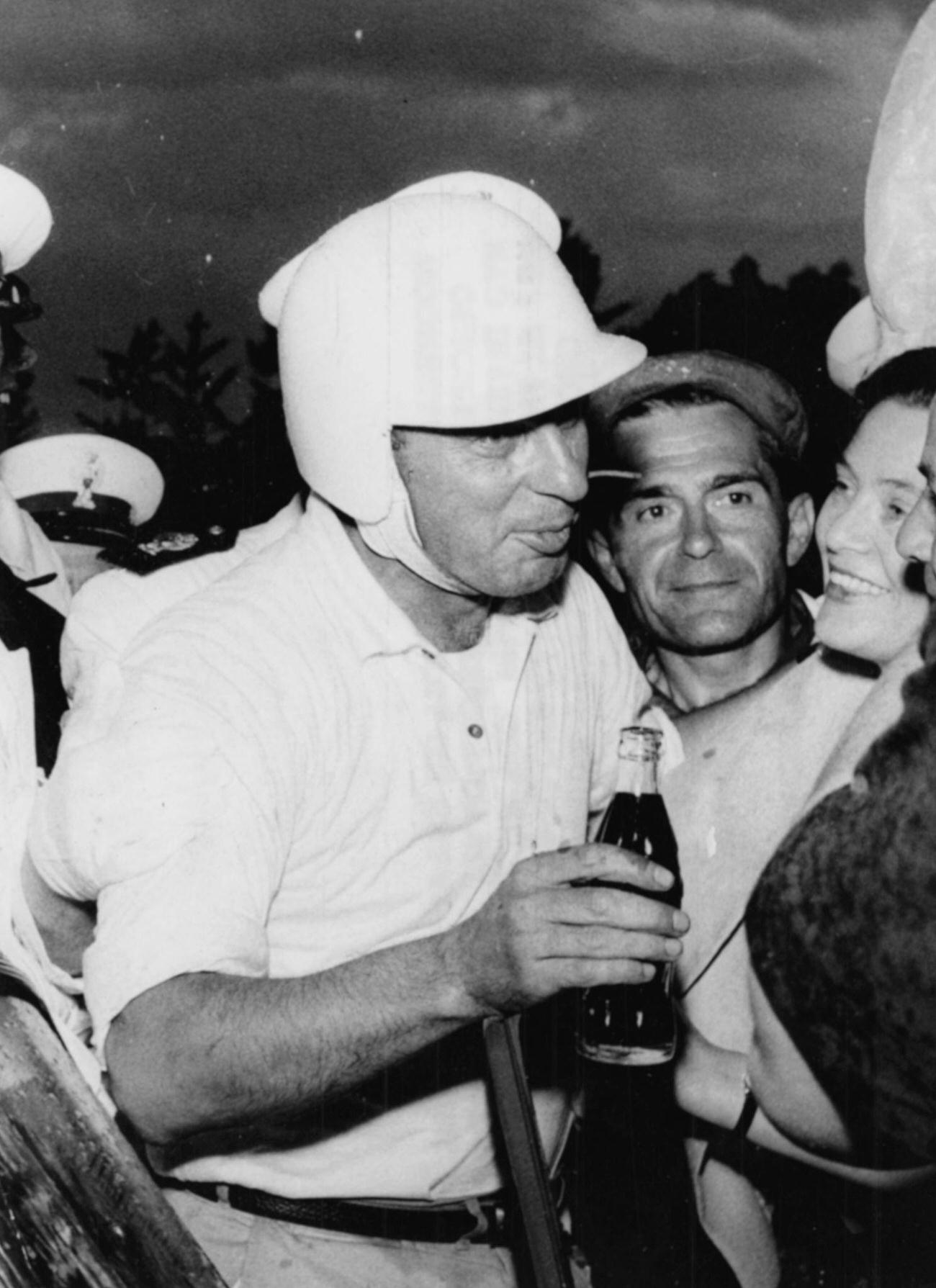 Racing driver Alfonso Thiele with Coca-Cola after winning Monza Grand Prix, June 28, 1959.